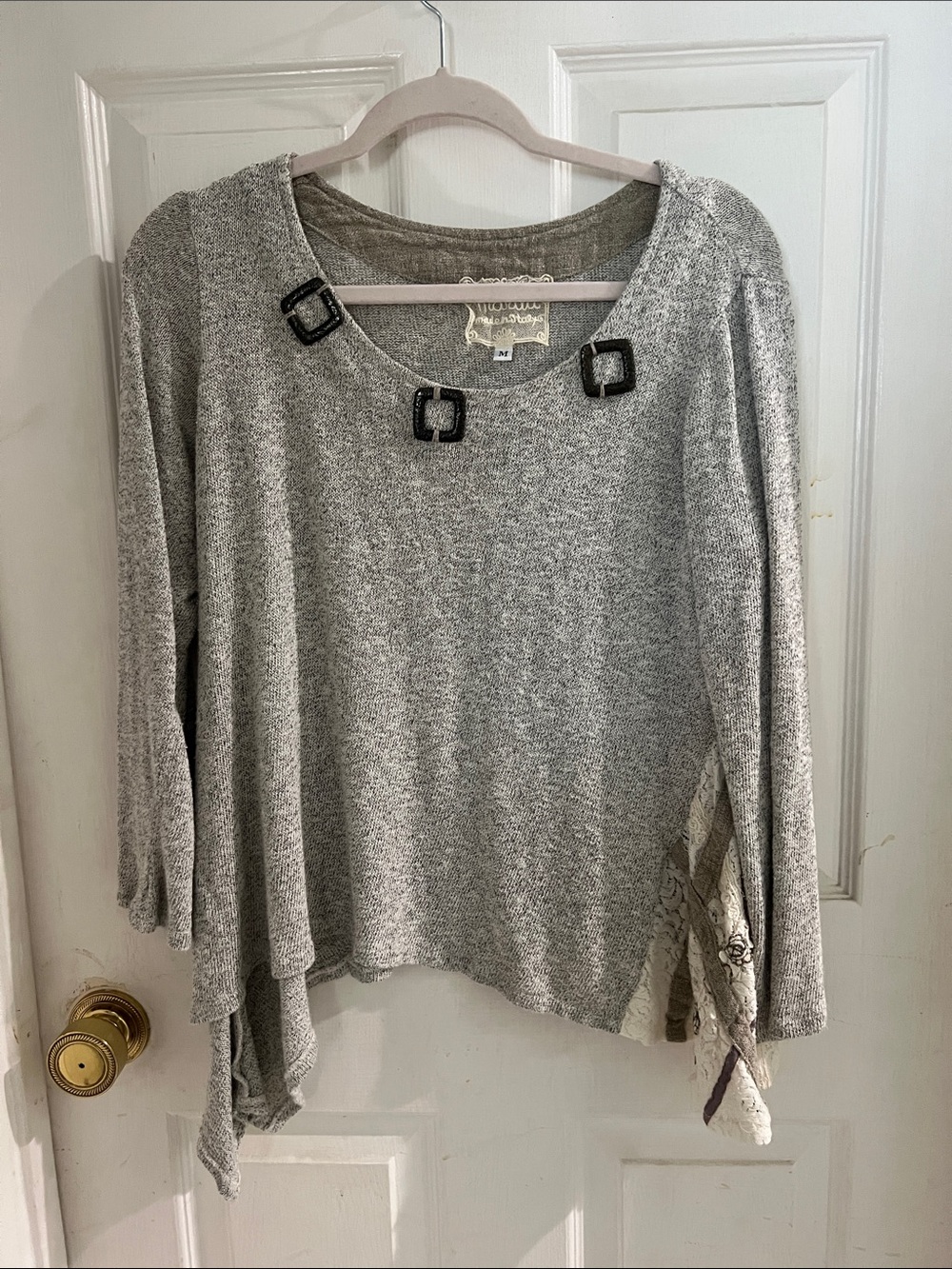 Marilu Cream Asymmetric Knit Top with Buckle Accents